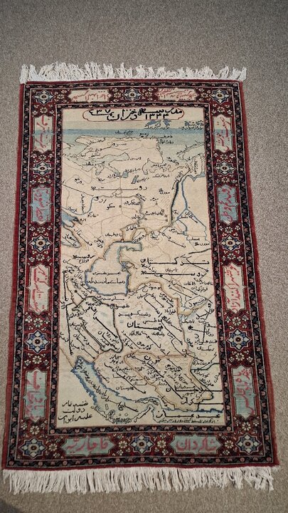 Iran’s image on a carpet woven by Iranian schoolgirls 100 years ago